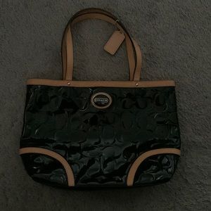 Small Coach patent leather handbag.